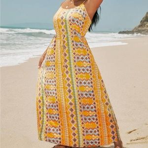 Beautiful flowy dress. Has string that matches to tie around middle.